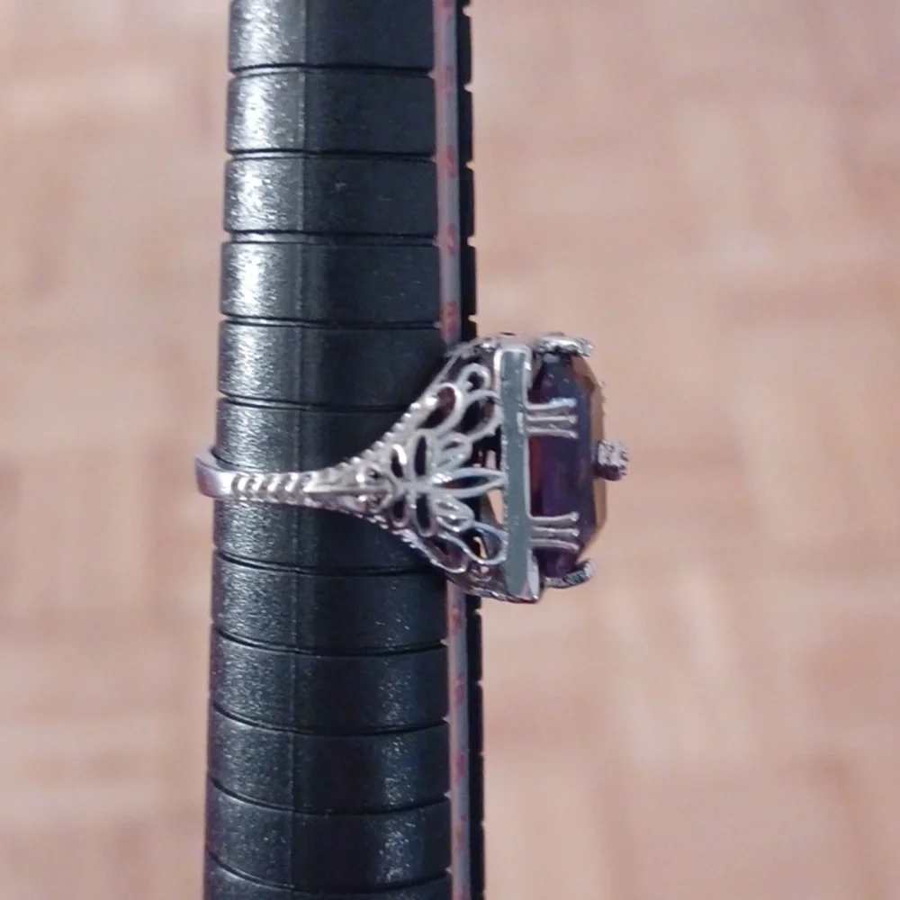 Silver ring marked s925 size 6 purple  stone